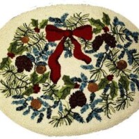 Oval-shaped holiday rug with pine branches, cones, and a red bow design.