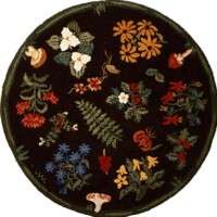 A round, floral-patterned rug with a dark background and various colorful flowers and plants.