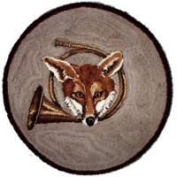 Round fox-themed rug with a depiction of a fox's face and tail.