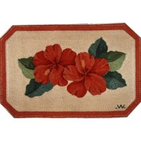 Octagonal textile with embroidered red flowers and green leaves design.
