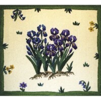 Embroidered floral design featuring purple irises and yellow flowers on a fabric background.