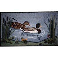 Two ducks swimming in a pond, depicted on a woven rug.