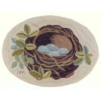An oval illustration of a bird's nest containing eggs, surrounded by green leaves.