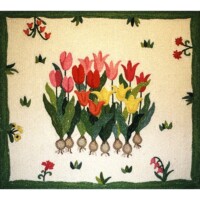 Embroidered image of colorful tulips with a green border, showcasing floral artistry.