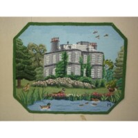 Embroidered depiction of a stately home with surrounding garden and pond.