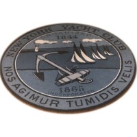 Round emblem with nautical and rowing imagery, featuring the text "new york yacht club 1844" and the motto "agimur tumidis velis.