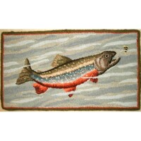 Embroidered rug featuring a fish design with wavy water patterns in the background.