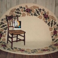 Wooden chair with a striped cushion placed on a floral-patterned rug against a wooden-paneled wall.
