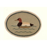 Embroidered patch featuring a duck floating on water within an oval border.