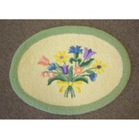 Oval floral rug with a pastel bouquet design on a beige background, surrounded by a green border.