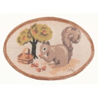 Embroidered depiction of a squirrel next to a basket and tree on an oval background.