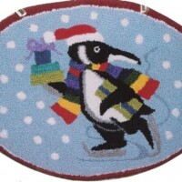 A festive-themed rug featuring a cartoon penguin wearing a santa hat and scarf, carrying a stack of colorful presents.
