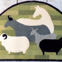 A sheep and goats rug.