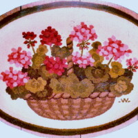 A vintage illustration of a basket filled with blooming flowers, enclosed within an oval border.