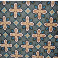Floral and geometric patterned carpet with blue, brown, and beige hues.