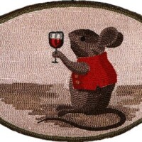 An embroidered patch depicting a mouse in a red shirt holding a glass of red wine.
