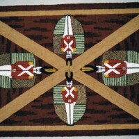 Handwoven rug featuring geometric and tribal patterns.