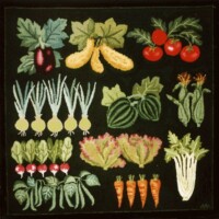 Embroidery of assorted vegetables on a black background.