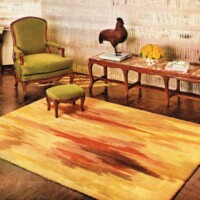 A vintage living room setup with a green armchair, matching footstool, a decorative bird sculpture on a coffee table, and a yellow rug with a red pattern.