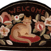 Semicircular doormat with "welcome" text and a cat surrounded by flowers.